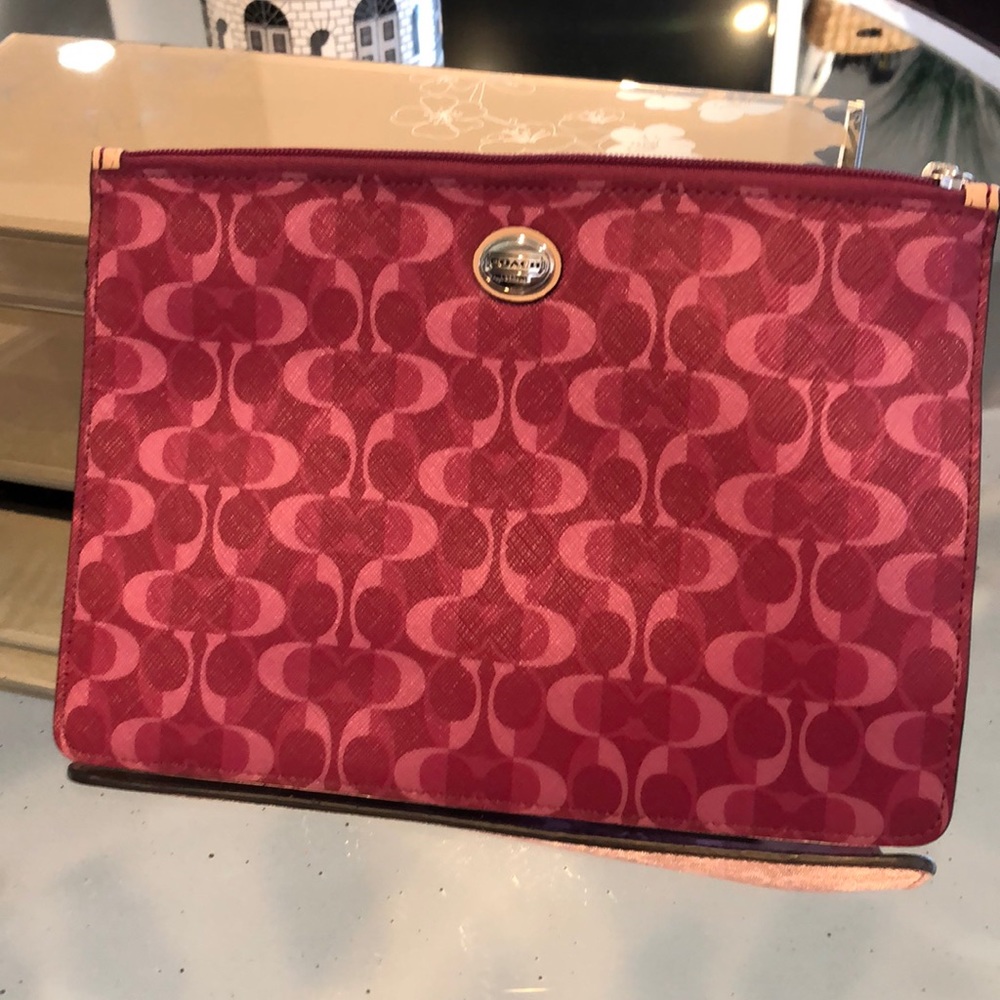 Coach berry and pink tech bag